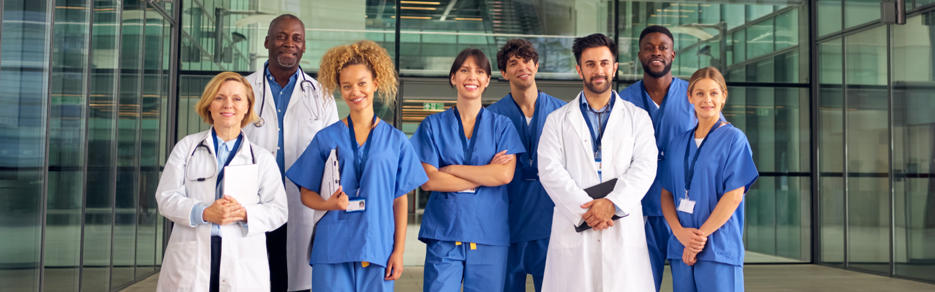 medical staffs with hospital in their background